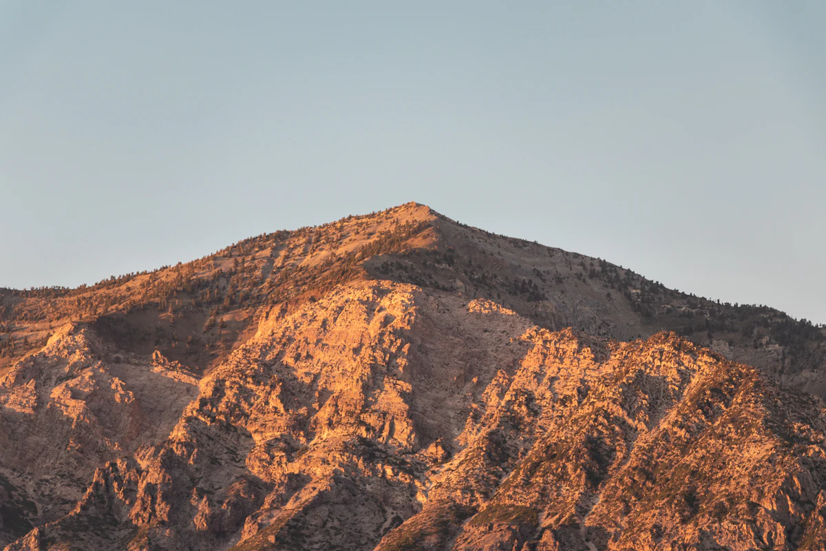 The bare slopes of Ben Lomond in low sun above Ogden, Utah