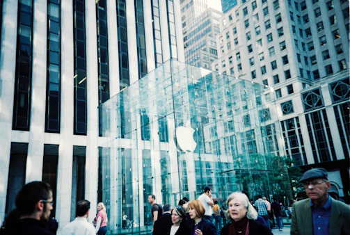 The firm’s team walking through the bustling entrance of 425 Madison Avenue, showcasing hands-on management.