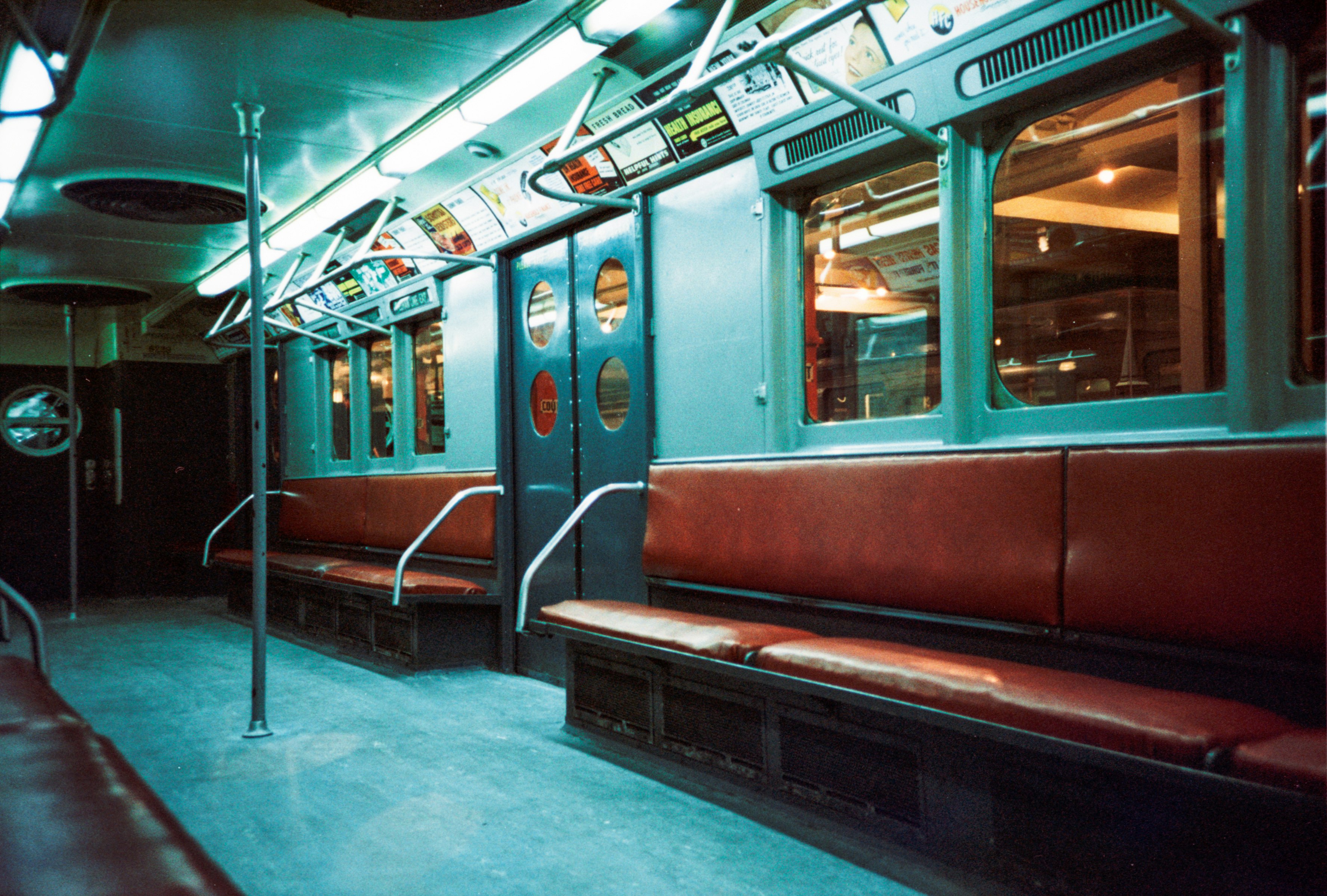 red and white train in train station