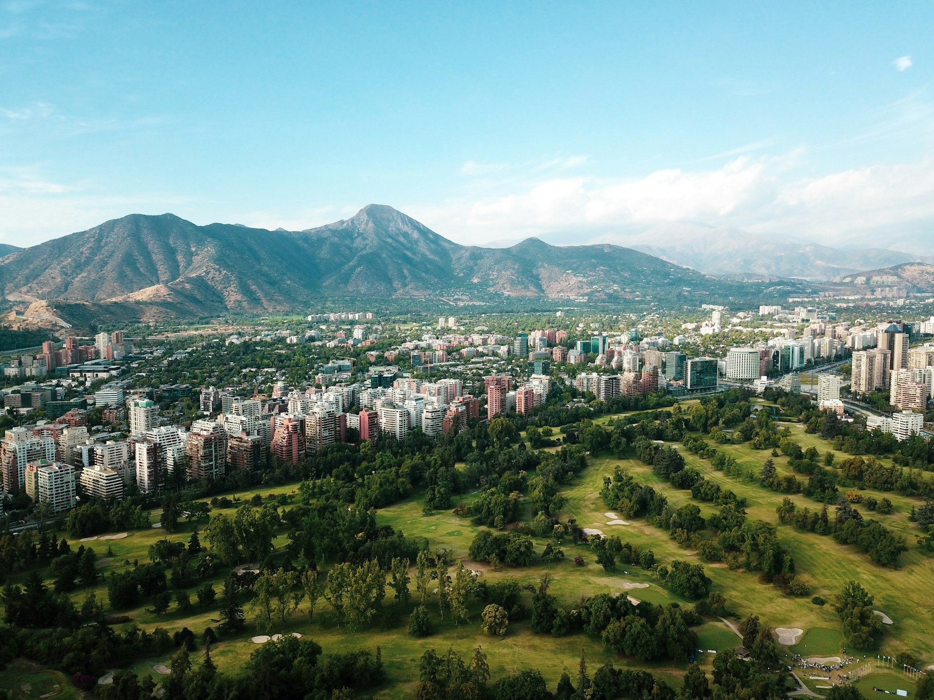 city buildings on green grass field during daytime