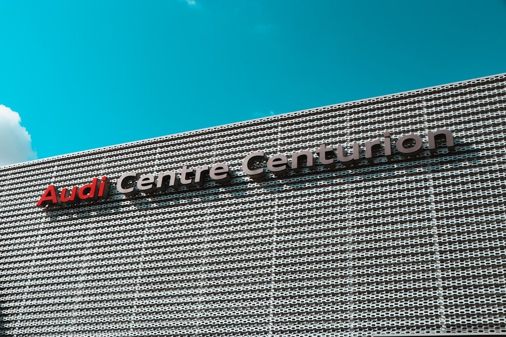 a tall building with a red sign on it's side