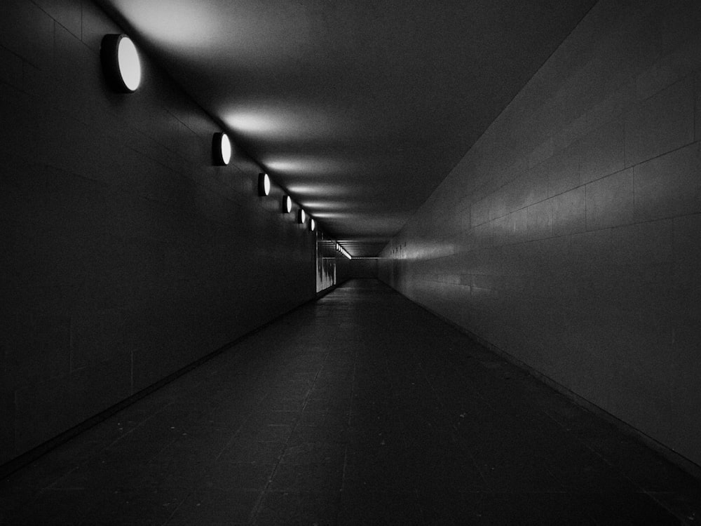 grayscale photo of empty hallway