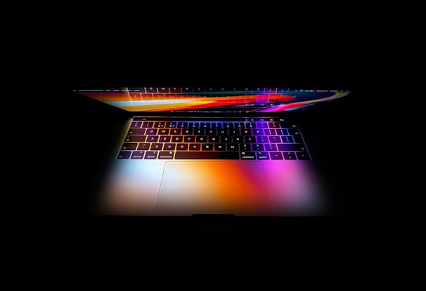 A vibrant digital entertainment interface displayed on a sleek laptop screen.