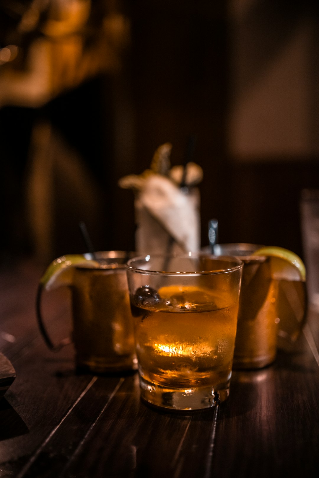 clear glass mug with brown liquid