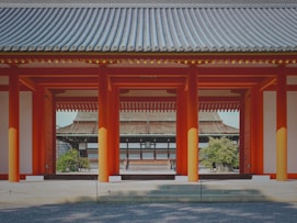 Wide shot of a Japanese-inspired home construction site in Thailand, highlighting traditional woodworking techniques.