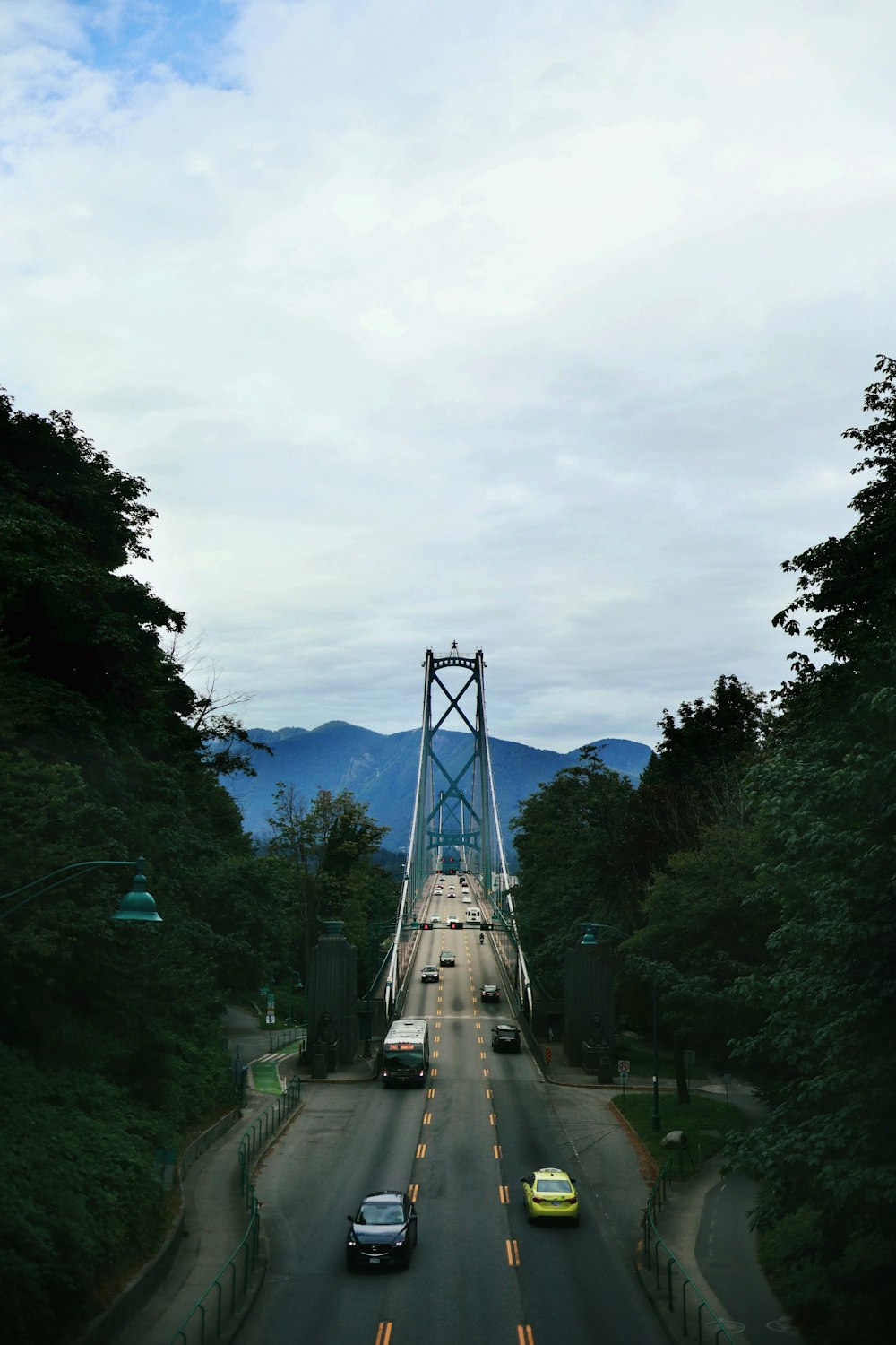 white car on gray concrete bridge during daytime