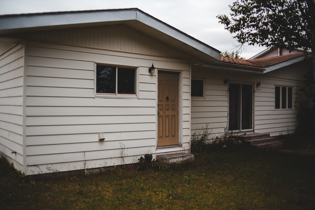 white wooden house with white wooden window