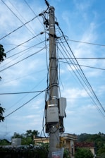 Aerial view of telecom poles and cables along a suburban street in British Columbia.