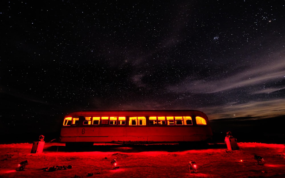 white and red train under starry night