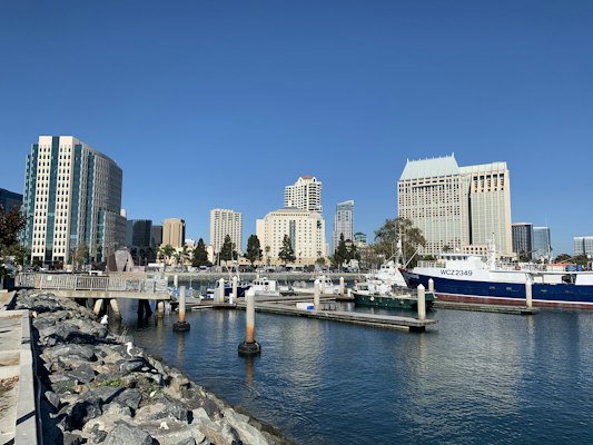 White and blue boat on sea near city buildings during daytime — San Diego, United States