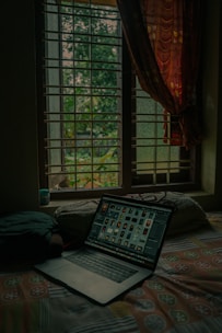 A calm and inviting therapy session setup with a laptop and cozy surroundings.