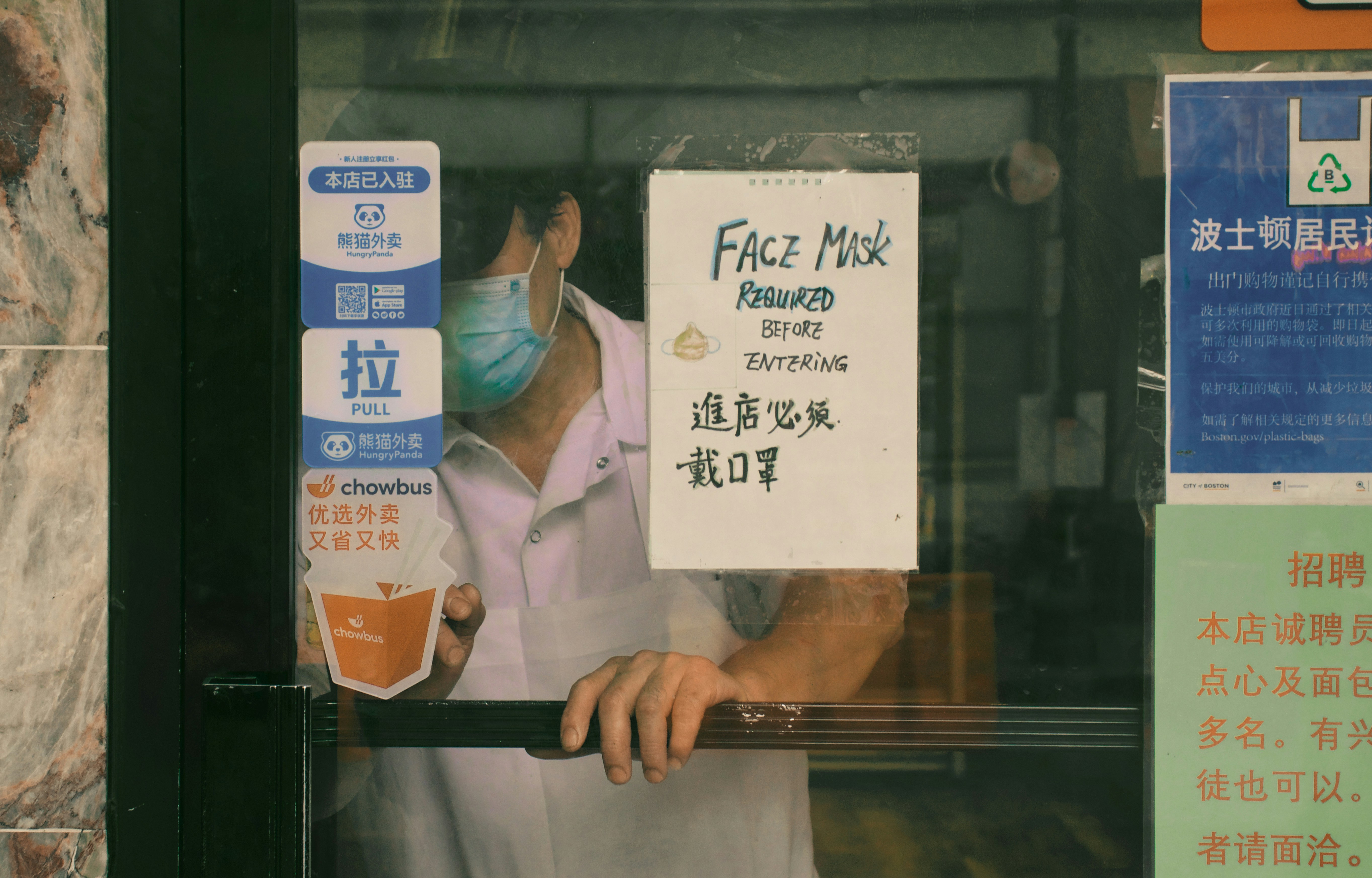 man in white button up shirt holding white printer paper