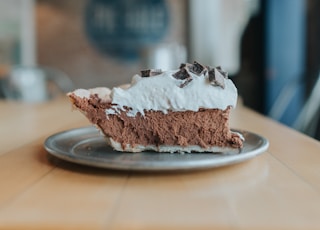 brown and white cake on white ceramic plate