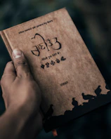 An artistic shot of a vintage Hindi book cover featuring traditional Indian motifs.