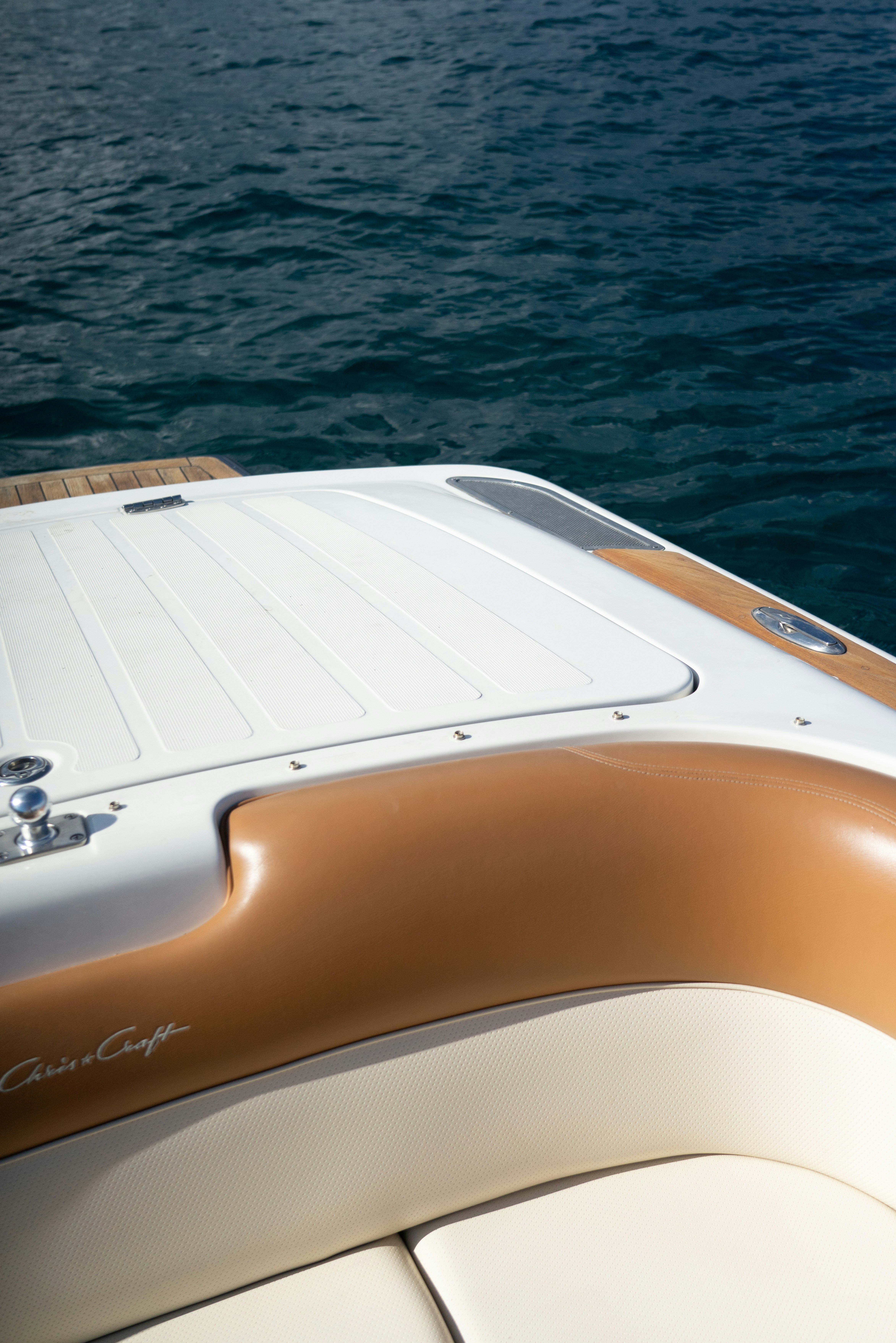 white and brown boat on water during daytime