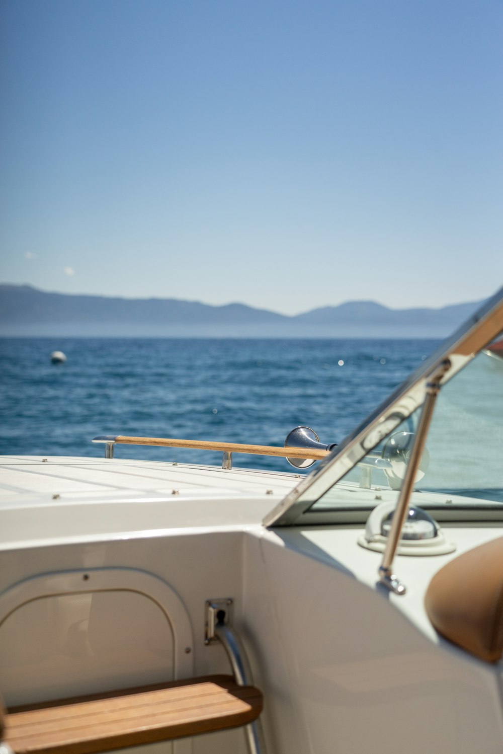 white boat on sea during daytime