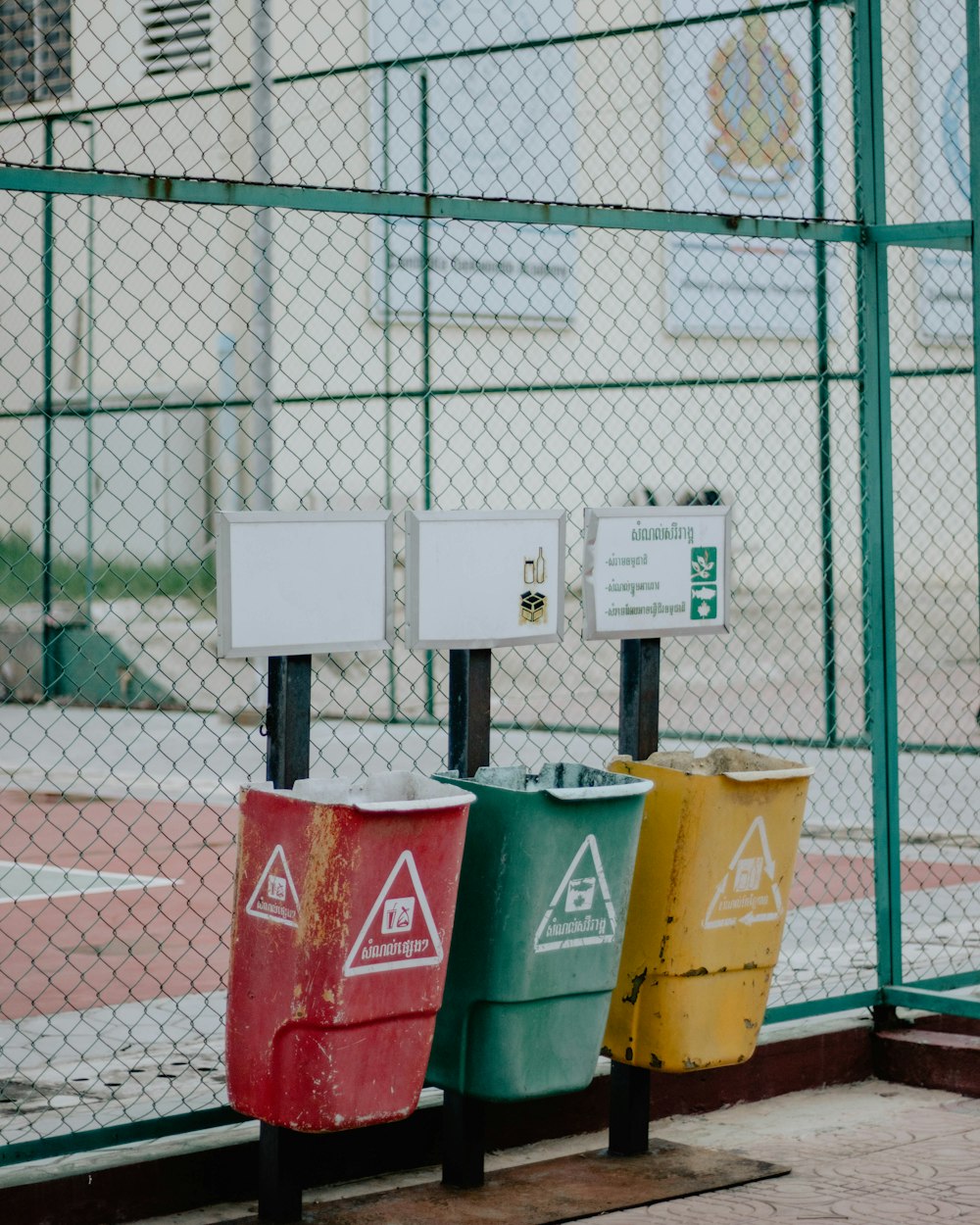 red and white trash bins