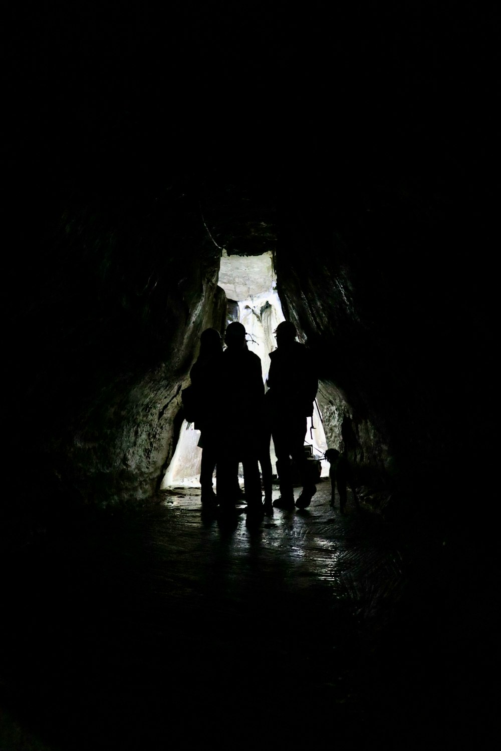 2 men in cave during daytime