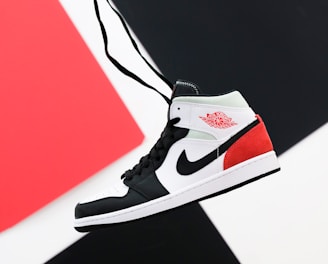 black white and red nike high top sneaker