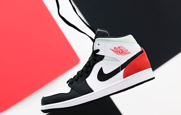 black white and red nike high top sneaker