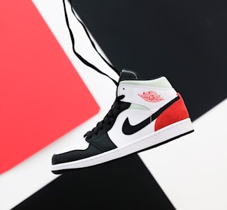 black white and red nike high top sneaker