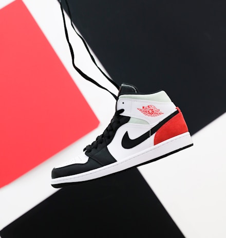 black white and red nike high top sneaker