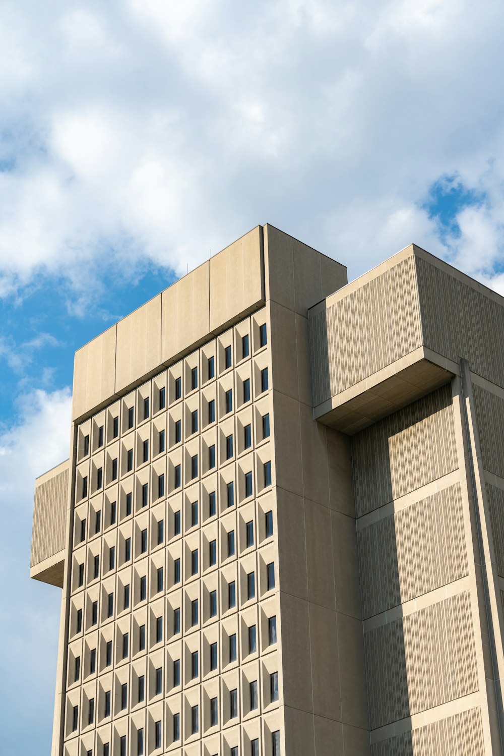 brown concrete building under blue sky during daytime