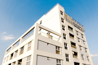 white concrete building under blue sky during daytime