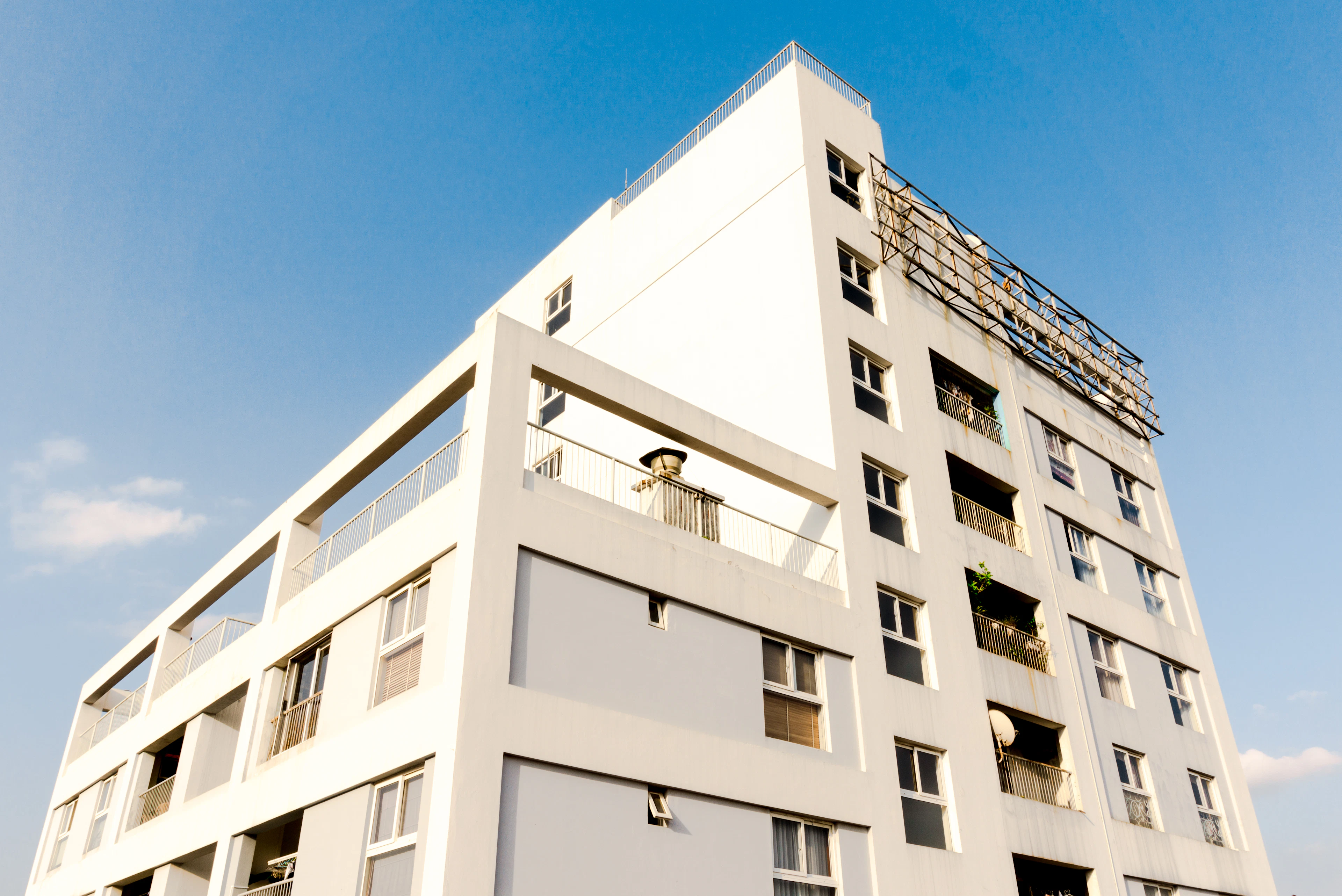 Modern apartment block against a blue sky