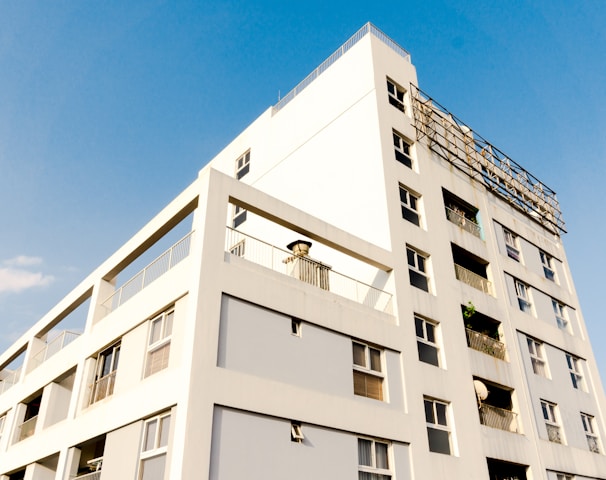 white concrete building under blue sky during daytime