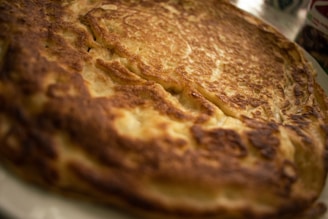 Warm Dutch baby pancakes being pulled apart to reveal a soft, fluffy inside