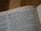 An open page of a Bible displaying text from the Old Testament. The passage titled 'Water from the rock' is prominently visible, with the story of Moses and the Israelites in the desert.