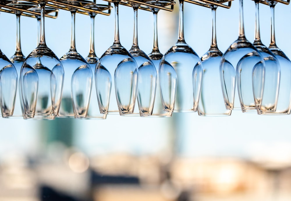 tilt shift lens photography of clear glass bottles