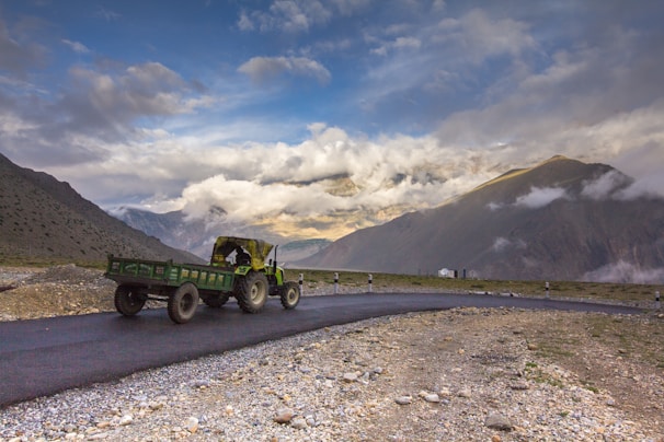 An Ecocasa Móvil being easily transported on a trailer along a scenic mountain road.