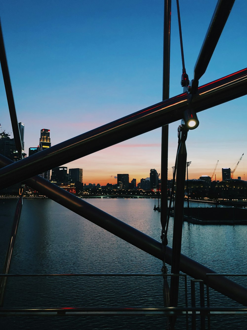 red metal bridge over river during daytime