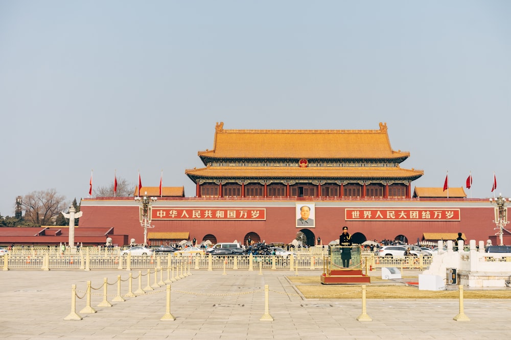 people walking on red and brown temple during daytime