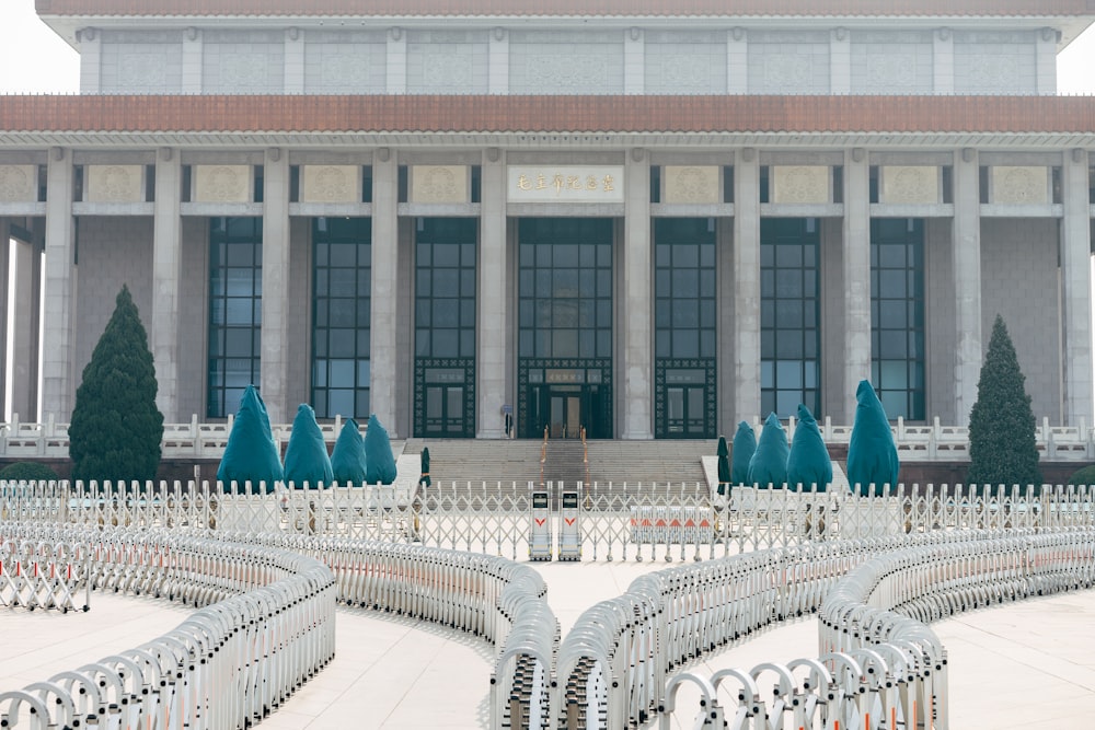 white and blue chairs on white concrete building