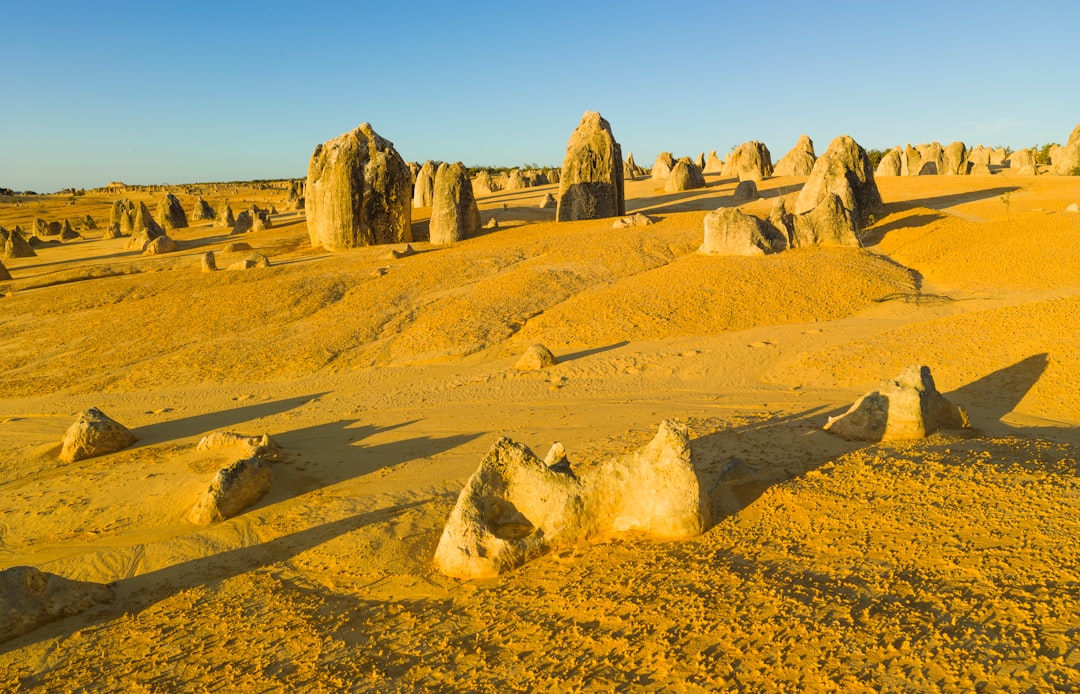 brown rock formation under blue sky during daytime