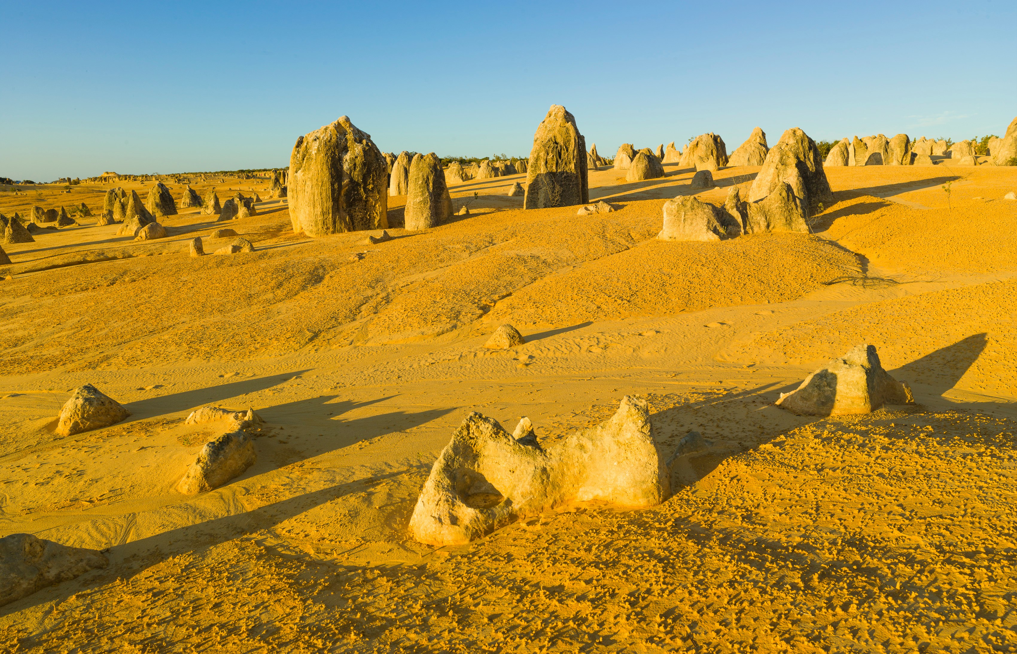 brown rock formation under blue sky during daytime