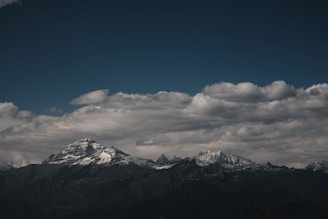 snow covered mountain under blue sky during daytime