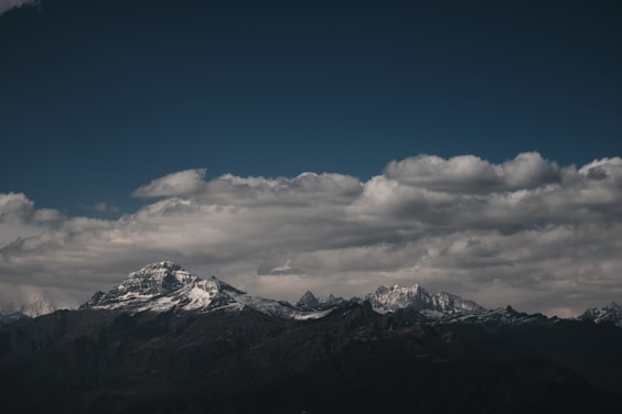 snow covered mountain under blue sky during daytime