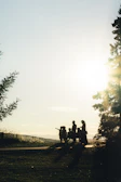 man and woman riding motorcycle on road during daytime