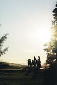 man and woman riding motorcycle on road during daytime
