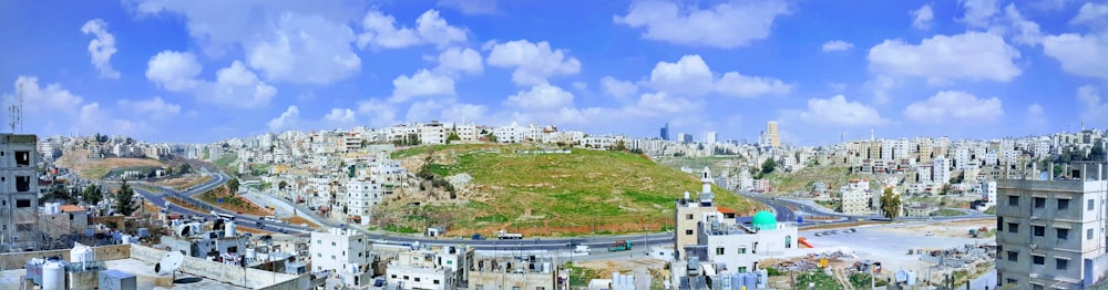 white concrete building on green grass field under blue sky during daytime