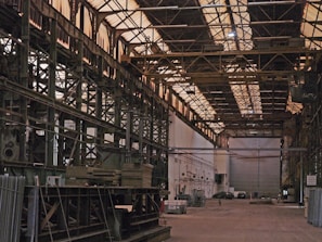 Industrial duster tool being used in a large warehouse environment