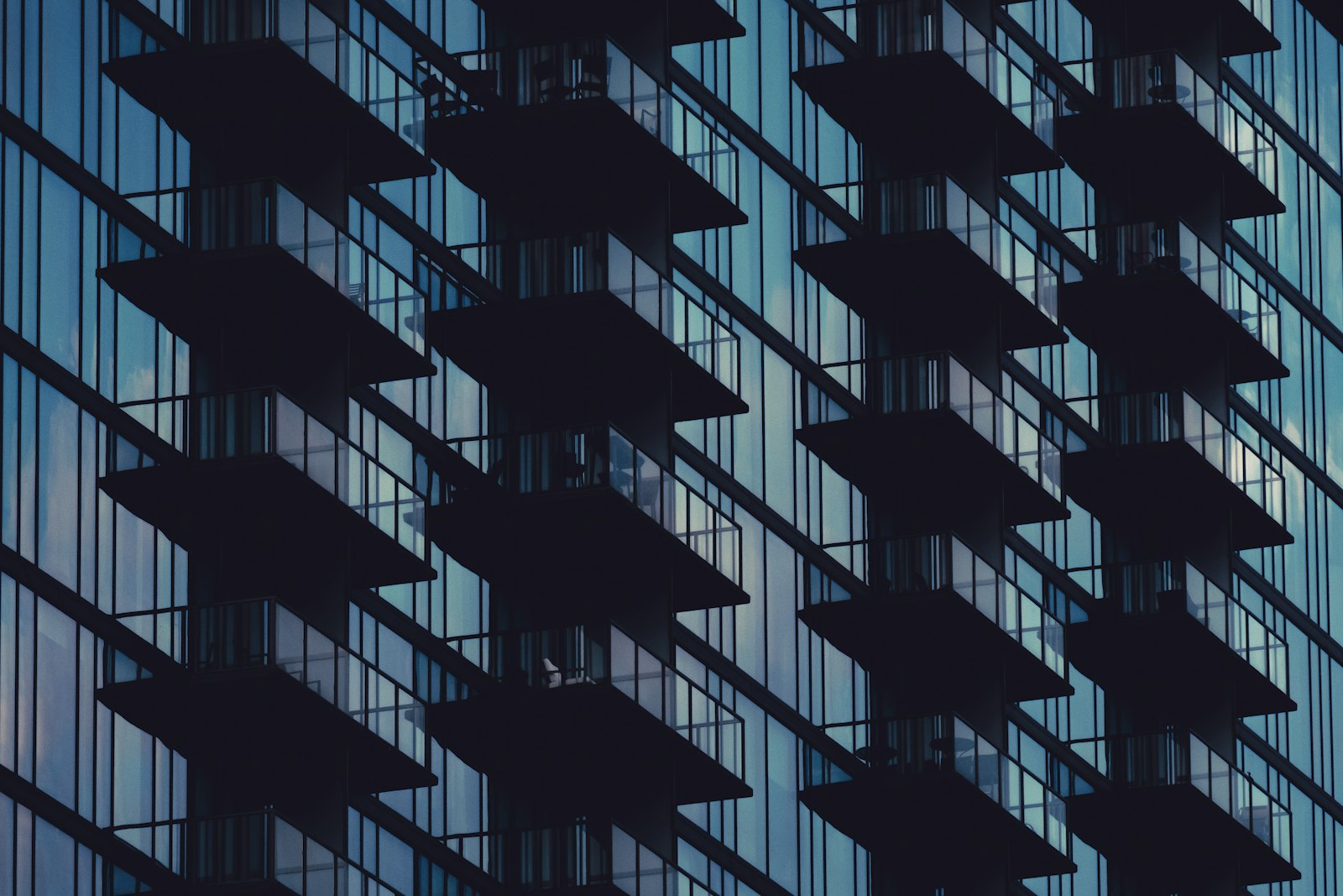 Modern high-rise apartment towers at dusk