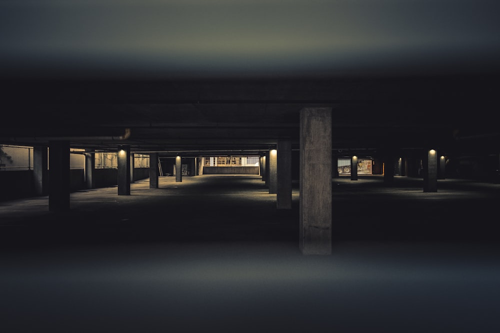 brown wooden dock with lighted lamp posts