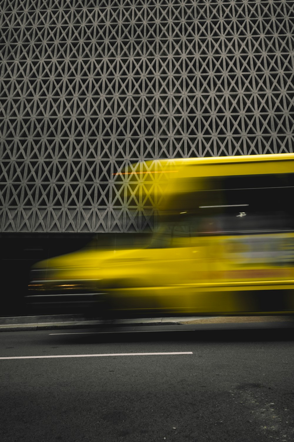 yellow car on gray asphalt road