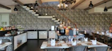 Elegant wall with subtle internal cladding in a stylish dining area.