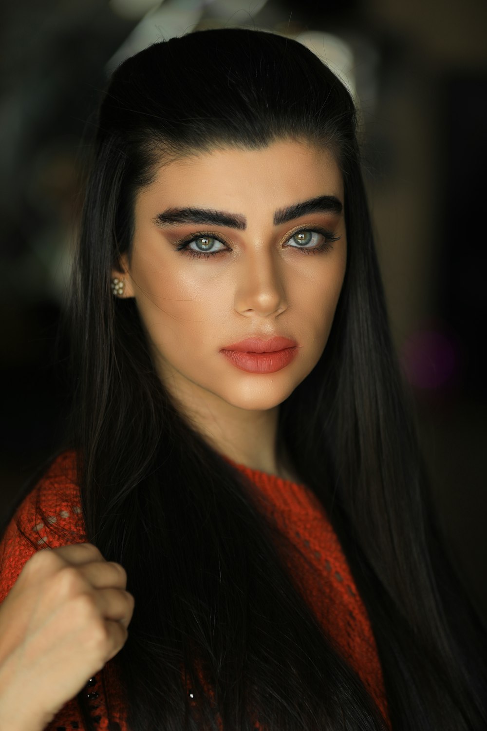 woman in red and orange scarf